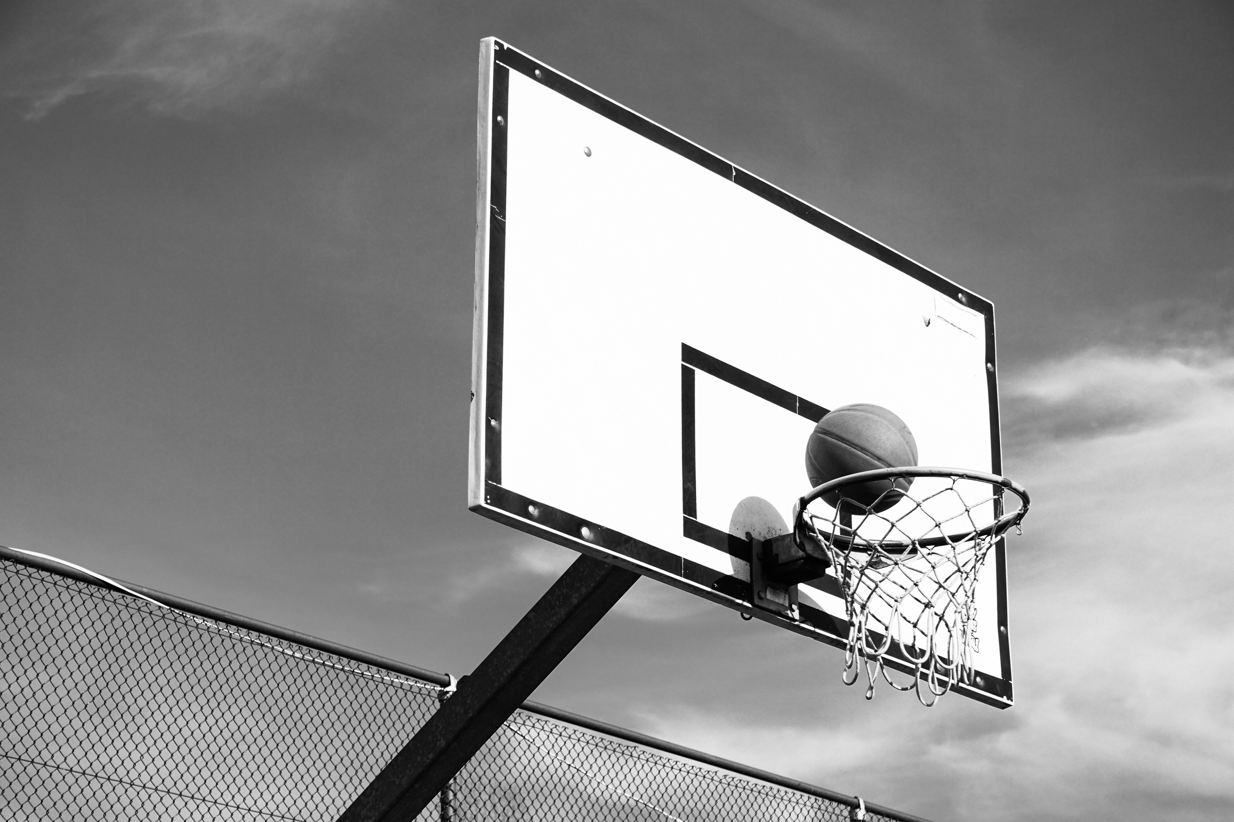Grayscale Photo of a Basketball Hoop